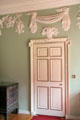 Plasterwork above door with tassel motif in vestibule at Newhailes. Musselburgh, Scotland.