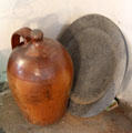 Ceramic crock marked A. Rennie, Leith in front of metal plate at The Study. Culross, Scotland.