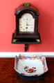 Shelf clock by Carpenter over porcelain bowl at Lauriston Castle. Edinburgh, Scotland.