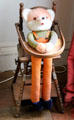 Convertible child's high chair with doll at Manderston House. Duns, Scotland.