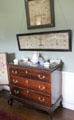 Samplers over chest of drawers in north dressing room at Manderston House. Duns, Scotland.