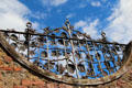 Sculpted cast iron screen over entrance at Priorwood Garden. Melrose, Scotland