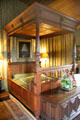 Copy of royal bed with small doors in side to allow access in Queen's bedchamber at Falkland Palace. Falkland, Scotland.