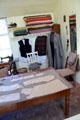 Cutting table in D MacPherson Tailor & Outfitter shop at Highland Folk Museum. Newtonmore, Scotland.
