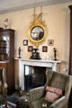 White marble chimneypiece with Regency convex mirror at Broughton House. Kirkcudbright, Scotland.