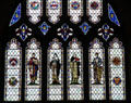 Stained glass depicting religious figures at Bristol Cathedral. Bristol, England.