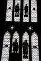 Panels of remaining figures in stained glass windows mostly destroyed during WWII. Bristol, England.