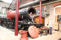 Female boilersmith working on engine at STEAM Museum of Great Western Railway. Swindon, England.