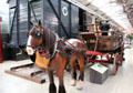 Model of horse dray being used to deliver goods to freight car at STEAM Museum of Great Western Railway. Swindon, England.