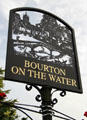 Metal sign depicting the center of the town. Bourton-on-the-Water, England