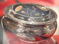 Silver box with enameled lid made by Guild of Handicraft with enameled flowers created by William Mark at Court Barn Museum. Chipping Campden, England.