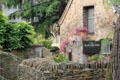 "The Slaughters" constructed of rough stone with dry stone wall. Lower Slaughter, England.