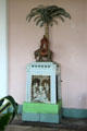 Indian artwork mounted on pedestal in Orangery at Sezincote. Moreton-in-Marsh, England.