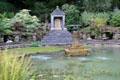 Spring fed pool with fountain & Temple to Surya at Sezincote. Moreton-in-Marsh, England.