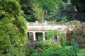 Footbridge across stream at Sezincote. Moreton-in-Marsh, England.