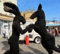 Hare & Donkey Dancing sculpture by Sophie Ryder on Market Place. Cirencester, England