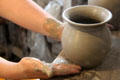 Forming wares on pottery wheel at Gladstone Pottery Museum. Longton, Stoke, England