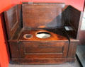 Replica of Thomas Crapper & Co flush water closet in bathroom history gallery at Gladstone Pottery Museum. Longton, Stoke, England
