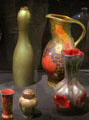 Earthenware vases in iridescent green or lustred colors by Zsolnay Factory of Pecs, Hungary at Potteries Museum & Art Gallery. Hanley, Stoke-on-Trent, England.