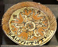 Slip decorated dish with tulip design by Ralph Toft of North Straffordshire at Potteries Museum & Art Gallery. Hanley, Stoke-on-Trent, England.