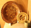 Slipware dishes with transparent yellowy lead glaze excavated in Burslem, Stoke at Potteries Museum & Art Gallery. Hanley, Stoke-on-Trent, England.