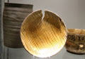 Slipware earthenware dish split during firing from Hanley, Stoke at Potteries Museum & Art Gallery. Hanley, Stoke-on-Trent, England.