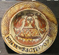 Slip decorated dish showing portrait of Queen Anne by John Wright of North Straffordshire at Potteries Museum & Art Gallery. Hanley, Stoke-on-Trent, England.