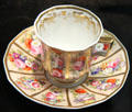 Bone china cup & saucer with floral decoration & gilding by Josiah Spode of Stoke-upon-Trent at Potteries Museum & Art Gallery. Hanley, Stoke-on-Trent, England.