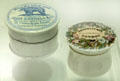 Earthenware bear grease hair ointment jar cover & ironstone pot cover for Piesse & Lubin perfume both made in Staffordshire at Potteries Museum & Art Gallery. Hanley, Stoke-on-Trent, England.