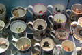 Collection of frog mugs used as jokes to startle 19thC beer drinkers when they saw toads considered poisonous emerge from their dark brews at Potteries Museum & Art Gallery. Hanley, Stoke-on-Trent, England.