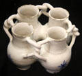 Tin-glazed earthenware fuddling cup made in Lambeth, London at Potteries Museum & Art Gallery. Hanley, Stoke-on-Trent, England.