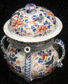 Tin-glazed earthenware posset pot painted in oriental style. made in Bristol or Brislington at Potteries Museum & Art Gallery. Hanley, Stoke-on-Trent, England.