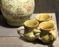 Fuddling cups decorated with white slip & scratches made in Donyatt, Somerset at Potteries Museum & Art Gallery. Hanley, Stoke-on-Trent, England.