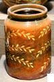 Earthenware storage jar with white slip made in Sussex at Potteries Museum & Art Gallery. Hanley, Stoke-on-Trent, England.