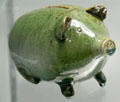 Earthenware piggy bank by Arthur Horns for Farnham Pottery of Surrey at Potteries Museum & Art Gallery. Hanley, Stoke-on-Trent, England.