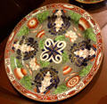 Wedgwood creamware dessert plate printed & painted with Imari Chrysanthemum pattern at World of Wedgwood. Barlaston, Stoke, England.