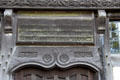 Carved wooden gothic text celebrating Queen Victoria over front door at Wightwick Manor. Wolverhampton, England.
