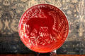 Ruby lustre plate with antelope inspired by medieval Islamic design by William De Morgan at Wightwick Manor. Wolverhampton, England.