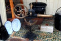 Antique rotary hand-cranked bellows in hardware store window at Ulster Folk Park. Belfast, Northern Ireland.