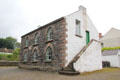 Gothic revival National School with stone front from Ballycastle on Chapel Lane at Ulster Folk Park. Belfast, Northern Ireland.
