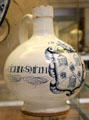 Tin-glazed earthenware wine bottle with arms of Pewterers' Co of London given as marriage gift to John Smith & Margeri from Southwark, London at British Museum. London, United Kingdom.