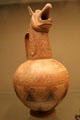 Terracotta jug in form of griffin's head painted with lion mauling a stag, and two horses made in the Cyclades at British Museum. London, United Kingdom.