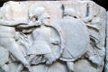 Frieze of soldiers of two sides in different helmets fighting hand to hand on Nereid Monument at British Museum. London, United Kingdom.
