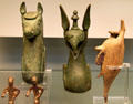 Etruscan bronze carriage shaft ends shaped as horse & griffin from Chiusi plus dead-hare perfume bottle from Nola, Campania at British Museum. London, United Kingdom.