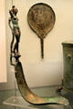 Etruscan bronze skin-scraping strigil with female-figure handle & engraved mirror from Palestrina, Latium at British Museum. London, United Kingdom.