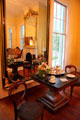 Parlor with table & mirror at Bragg-Mitchell Mansion. Mobile, AL.