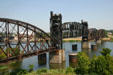 Lift span of retired Chicago, Rock Island and Pacific Railroad bridge over Arkansas River beside Clinton Presidential Library. Little Rock, AR