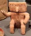 Tairona culture clay footed effigy vessel of flute player from Colombia at Tucson Museum of Art. Tucson, AZ.