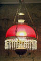 Ceiling oil lamp with red glass shade at Bird Cage Theatre. Tombstone, AZ.