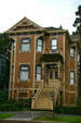 Brown Eastlake-style house. Sacramento, CA.